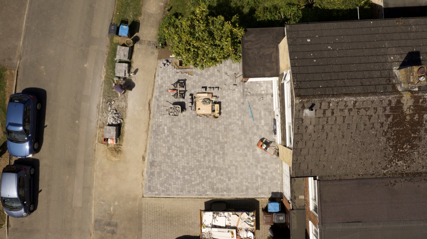 Aerial view of a driveway and property